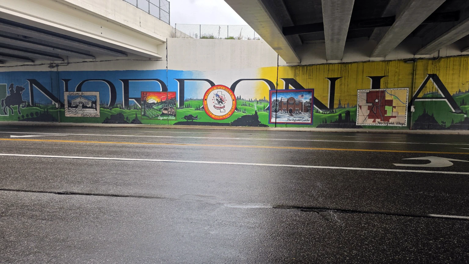 Macedonia mural showing local landmarks and community scenes